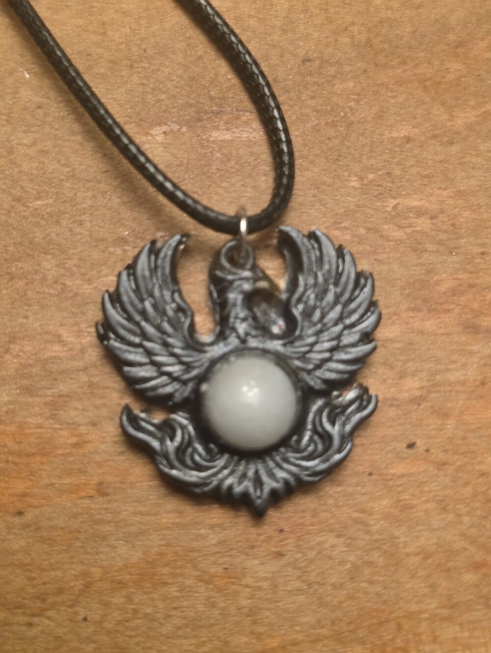 Black Phoenix With White Center Gemstone On A Black Cord Adjustable Necklace